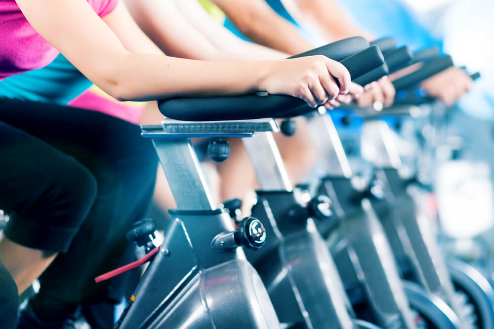 exercise class with stationary bikes