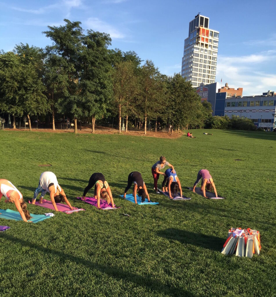 laura cipullo leading yoga class in a park