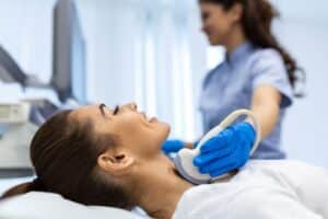 woman with thyroid condition receiving treatment