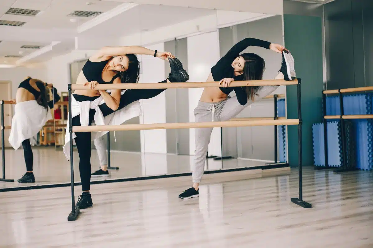 dancers stretching in dance studio