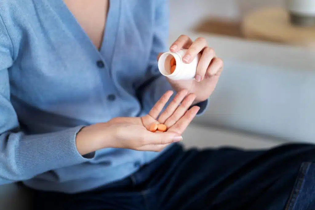 woman taking nutritional supplements