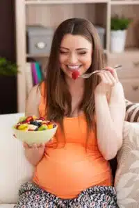 pregnant woman eating nutritious meal