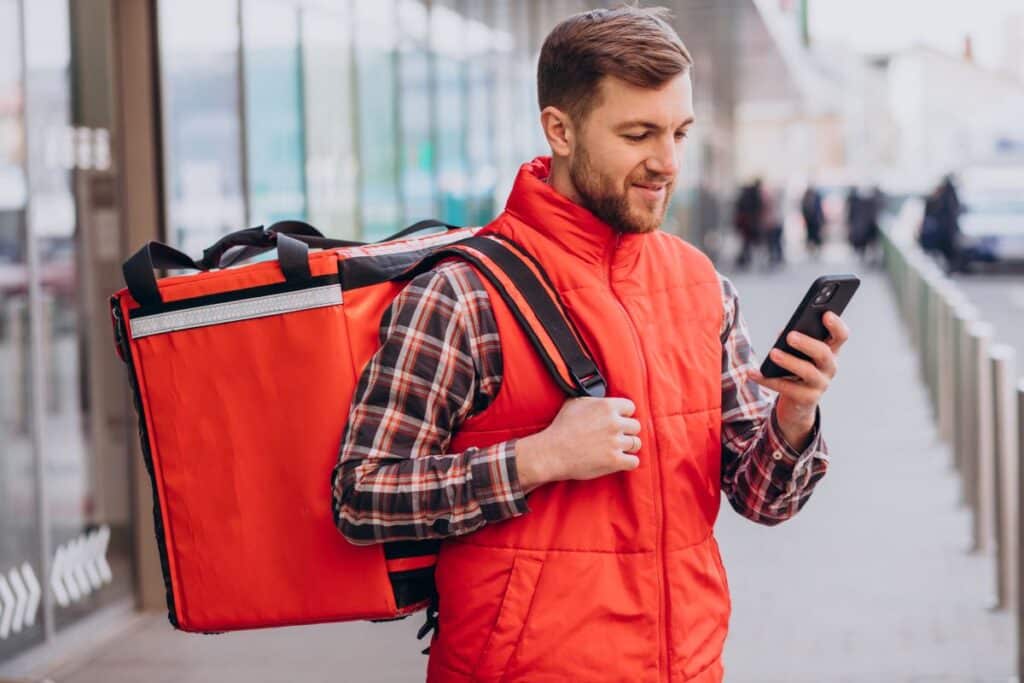 food delivery driver looking at seamless order