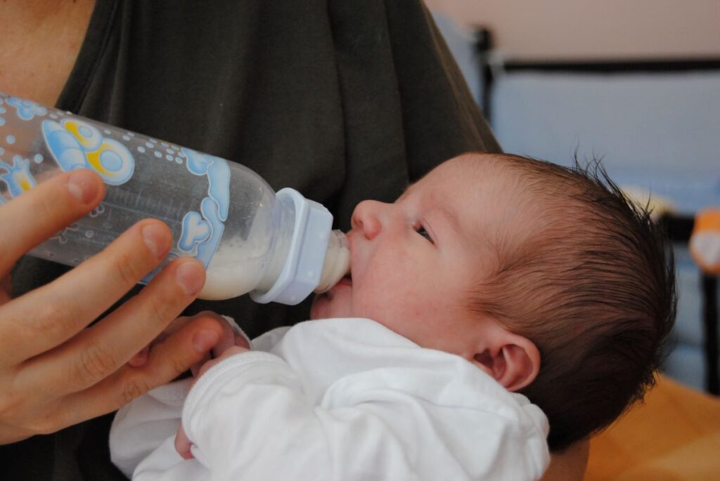 baby feeding from bottle