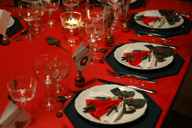 table set with holiday cutlery and decorations