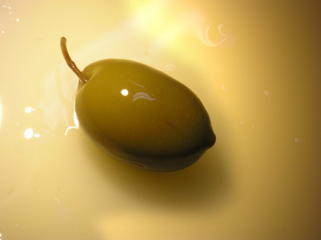 an olive with olive oil