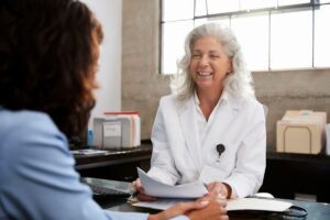 woman speaking with doctor