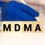 MDMA treatment lab with wooden blocks spelling MDMA